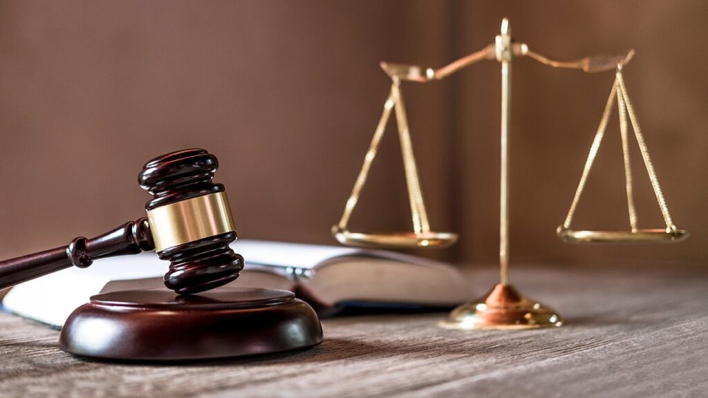 Legal excellence represented by scales of justice and gavel