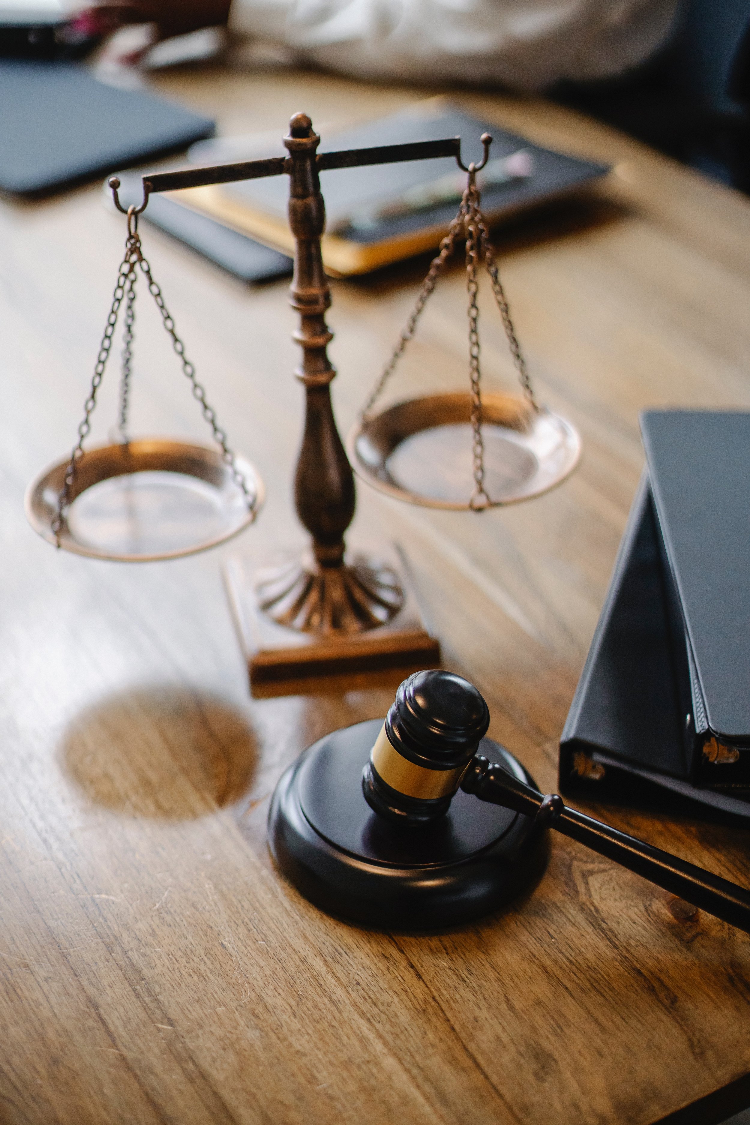 Modern legal workspace with scales of justice and technology